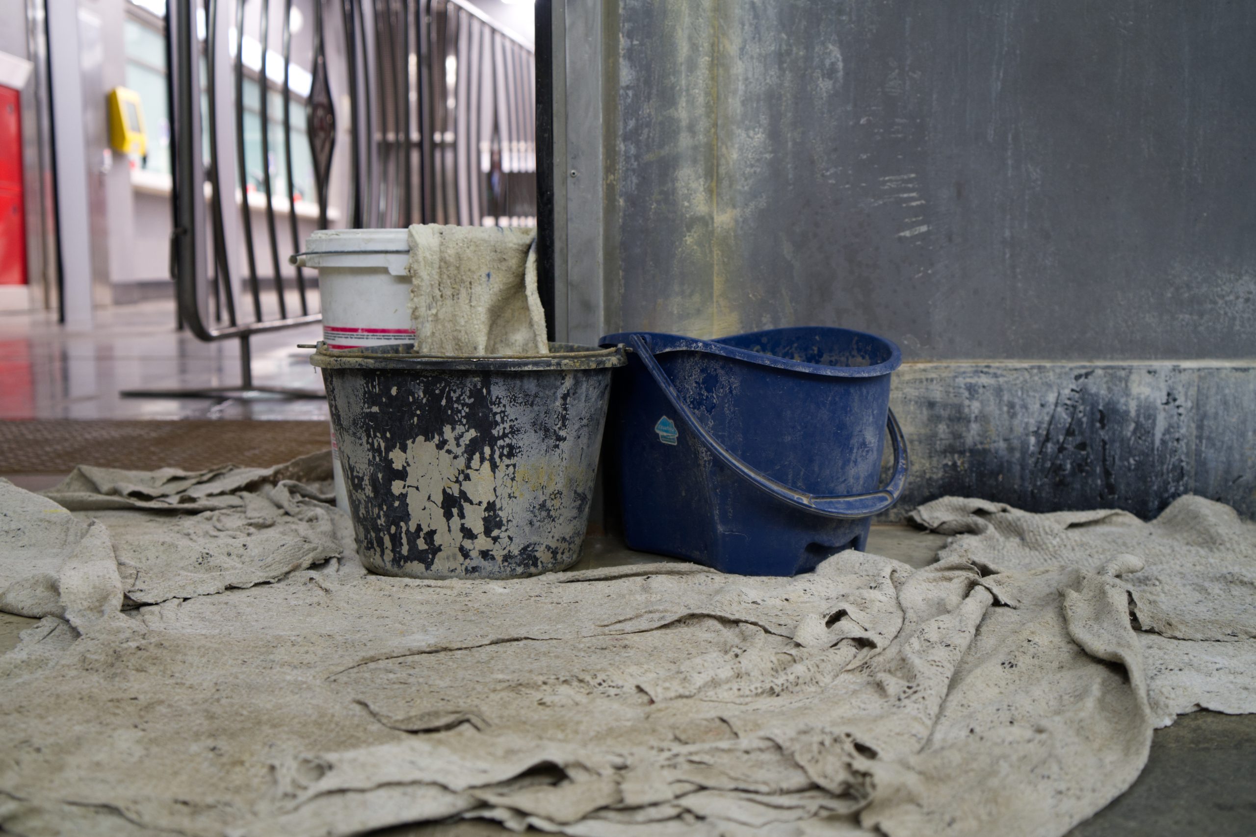 Buckets catching water from a leaking pipe