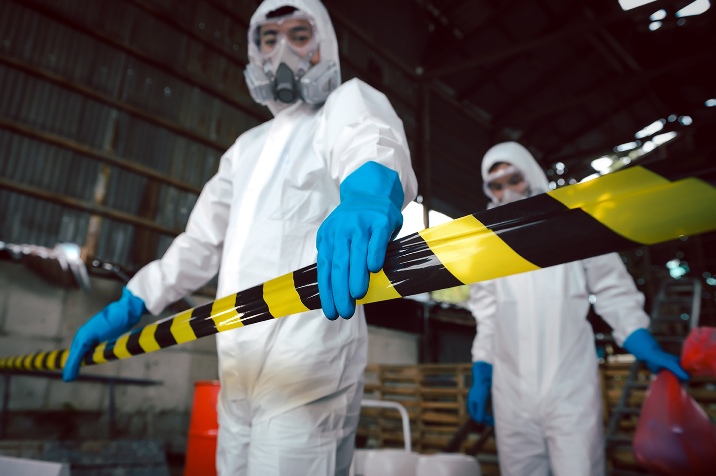 Hazard barrier tape marking a biohazard cleanup zone