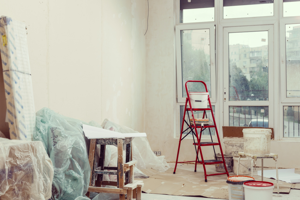 Interior repairs and wallpapering during home reconstruction